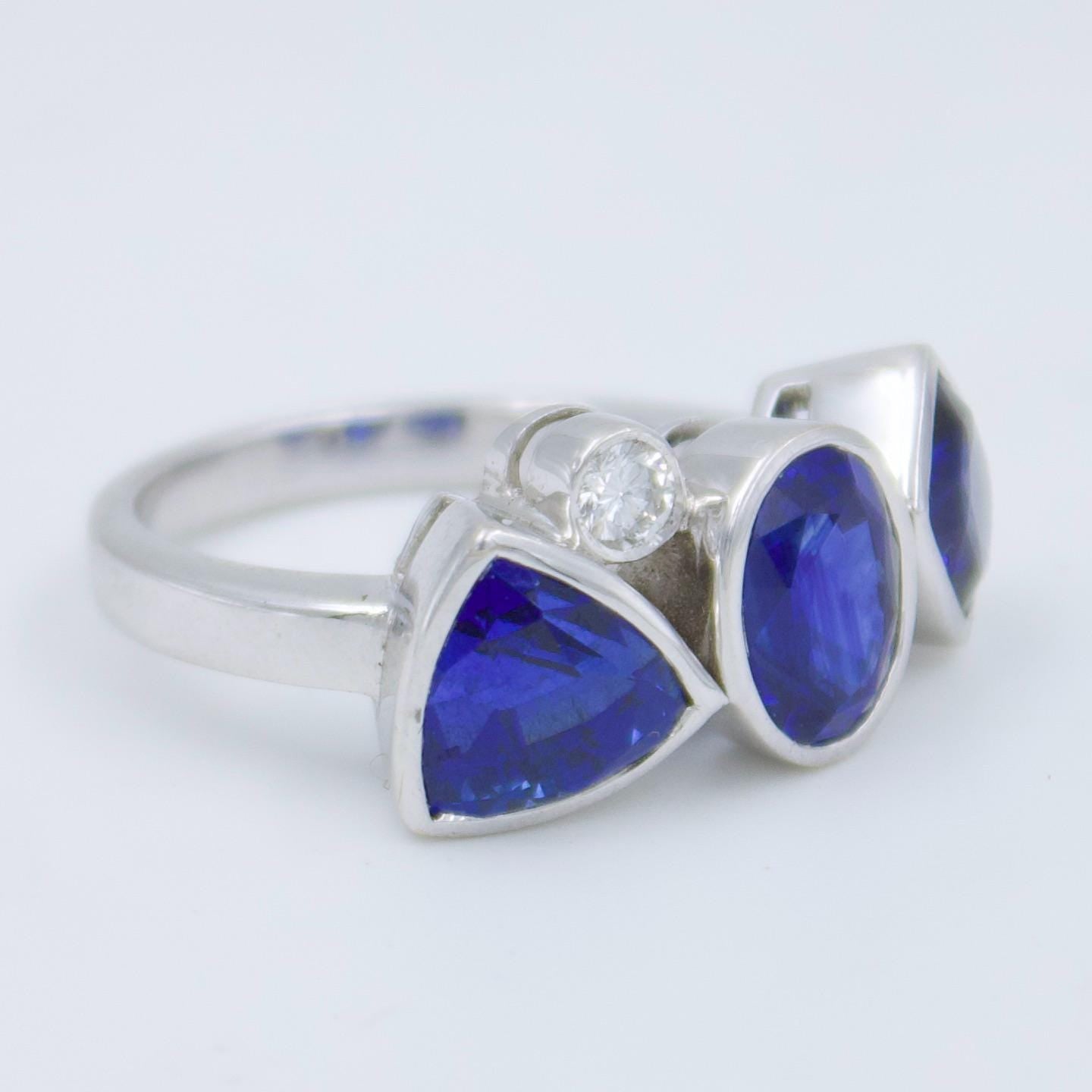 Luxurious IGI Certified 6.42 Ct Intense Blue Ceylon Sapphire Statement Three Stone Ring in 18K White Gold