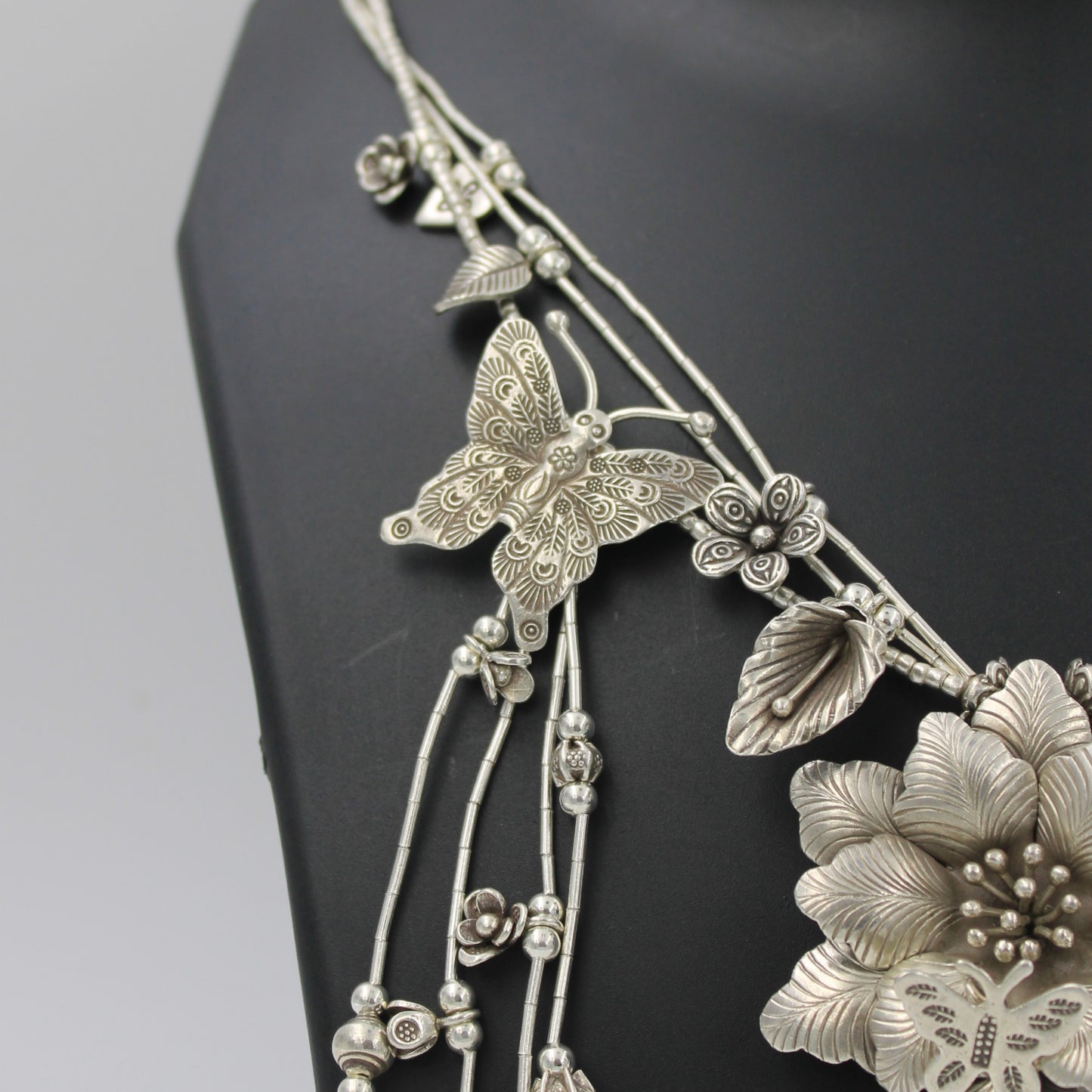Handmade Indonesian Flower and Butterfly Charm Necklace in Sterling Silver