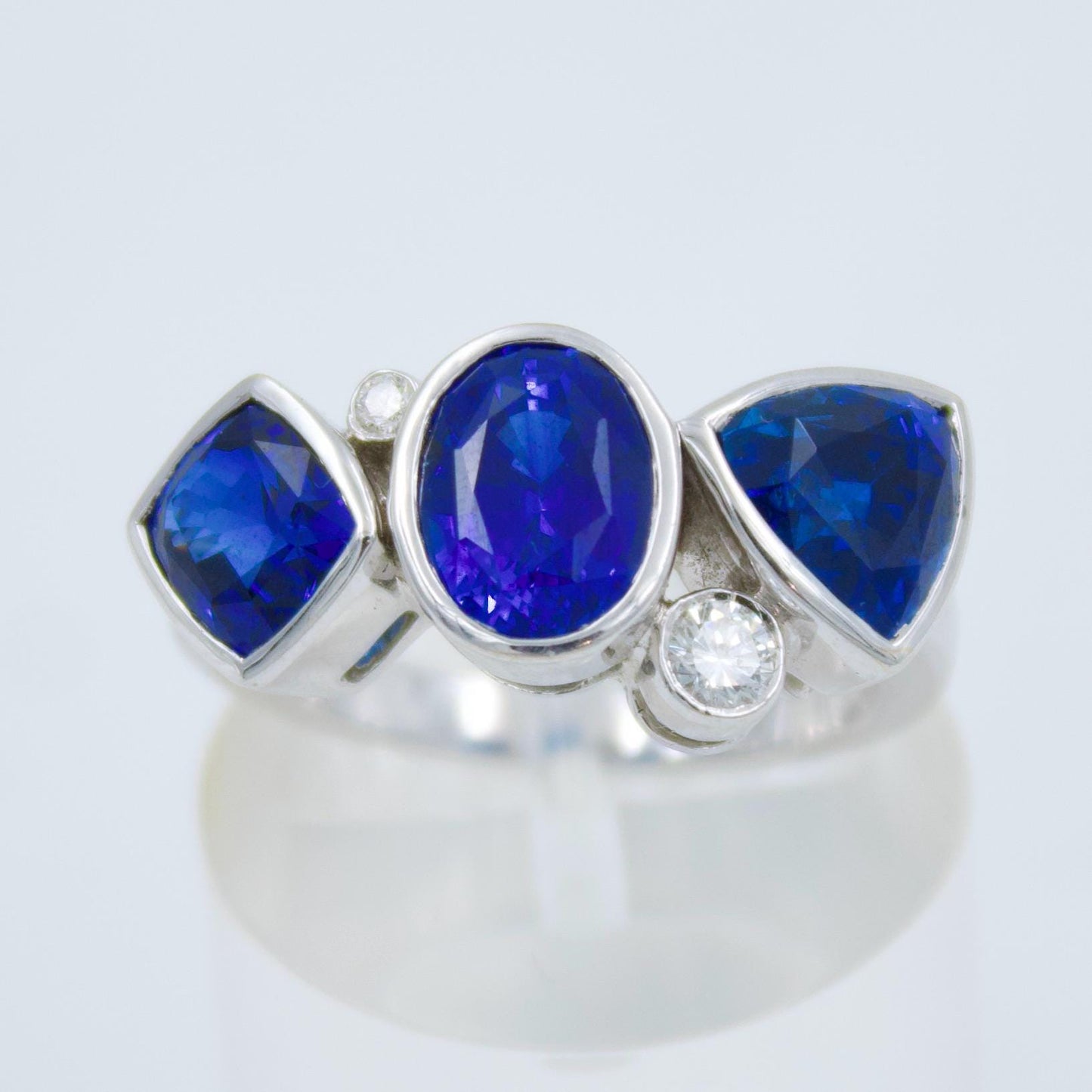 Luxurious IGI Certified 6.42 Ct Intense Blue Ceylon Sapphire Statement Three Stone Ring in 18K White Gold