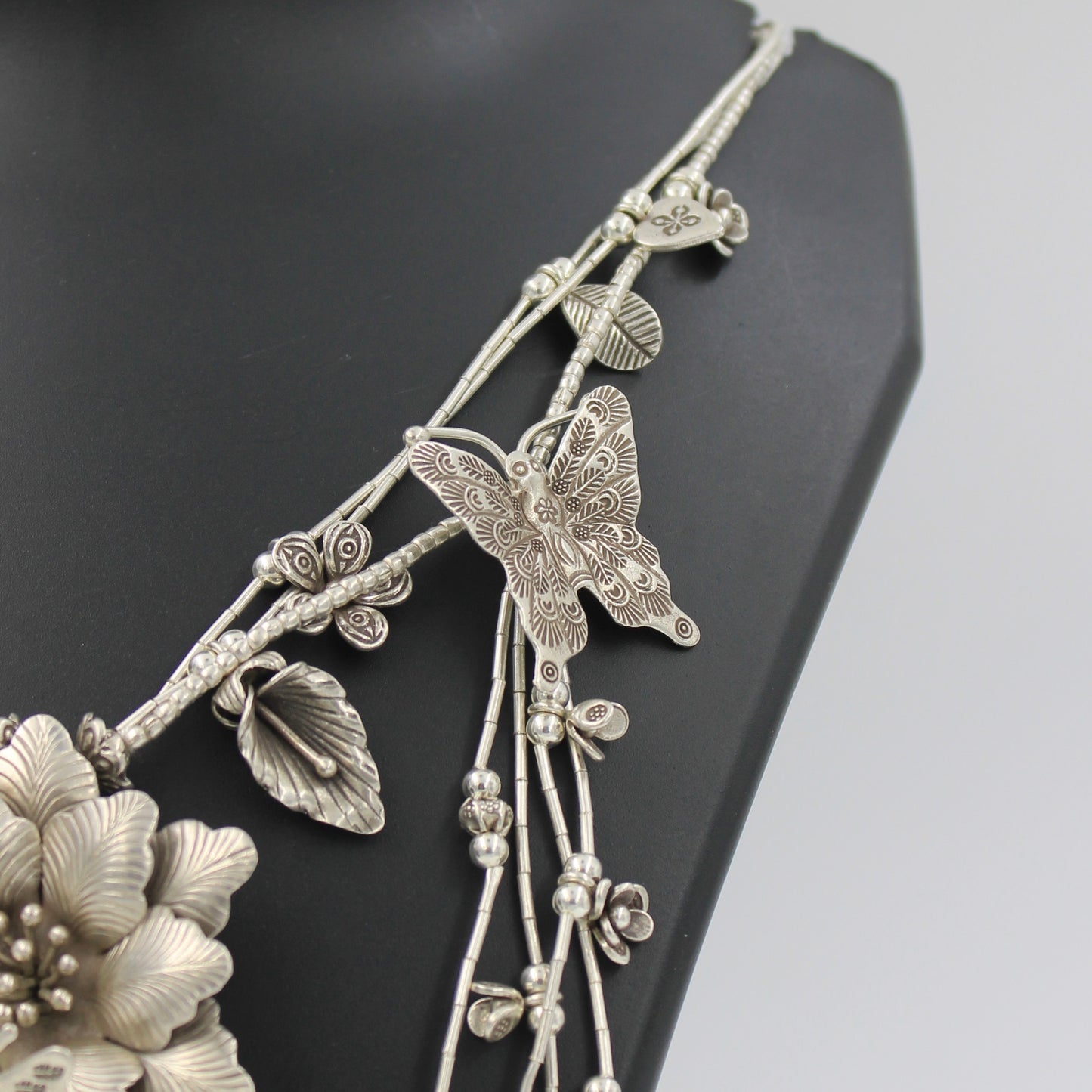 Handmade Indonesian Flower and Butterfly Charm Necklace in Sterling Silver