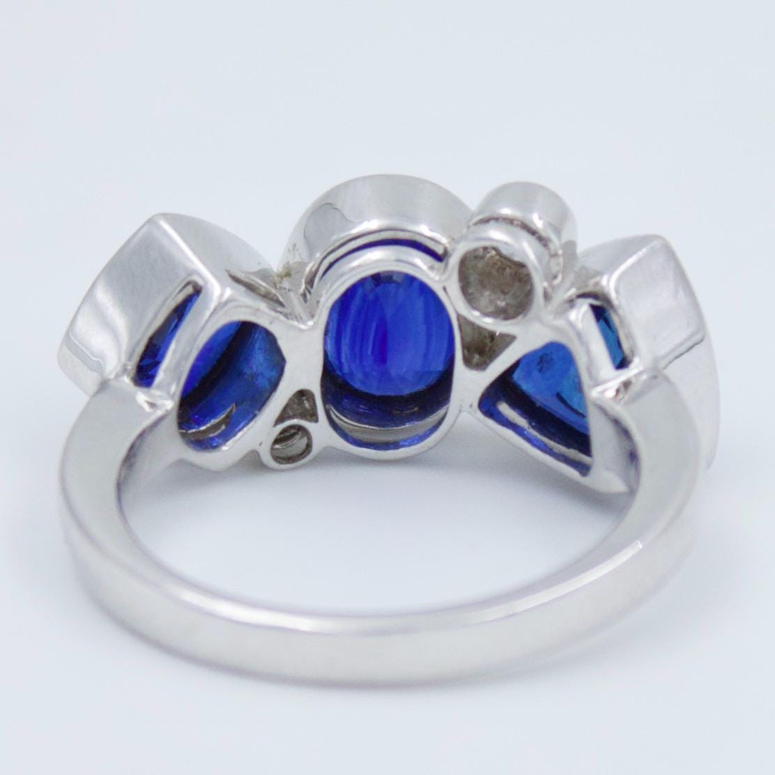 Luxurious IGI Certified 6.42 Ct Intense Blue Ceylon Sapphire Statement Three Stone Ring in 18K White Gold