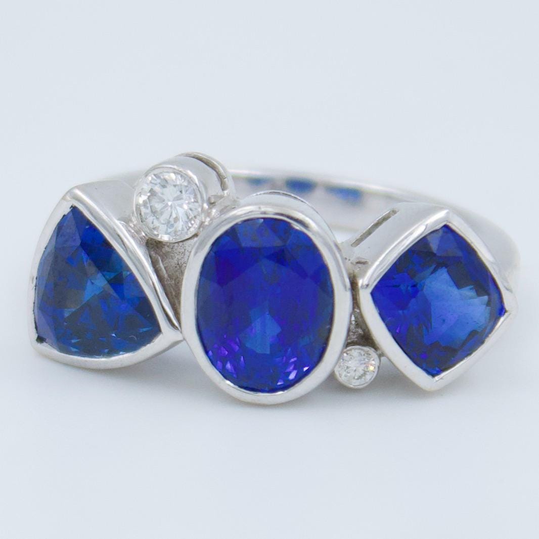 Luxurious IGI Certified 6.42 Ct Intense Blue Ceylon Sapphire Statement Three Stone Ring in 18K White Gold